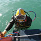 Diver in boat ladder.